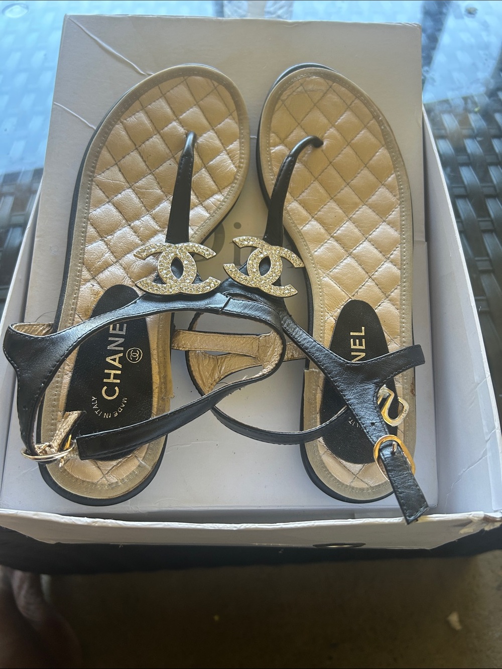 CHANEL Black Leather Sandals with Gold Quilted Footbed and CC Logo